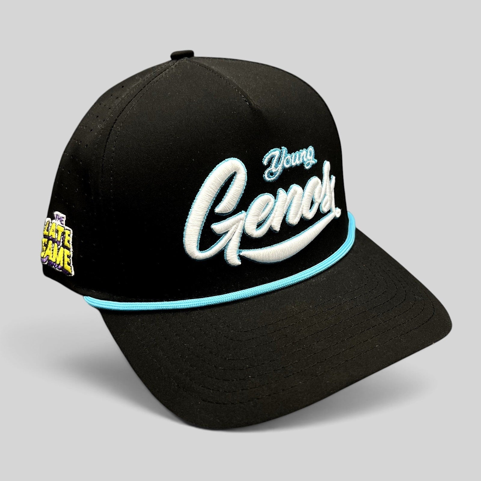 Raree Finds black snapback hat featuring Young Genos white and teal embroidery with a teal rope accent.