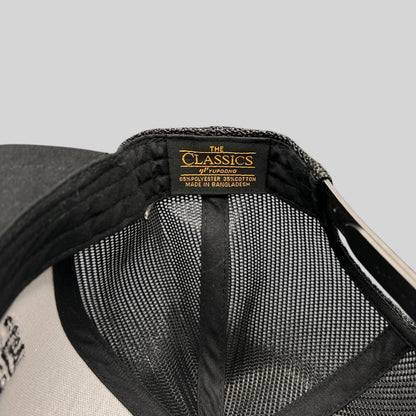 Raree Finds Yupoong Classics snapback hat interior label showing polyester and cotton material composition