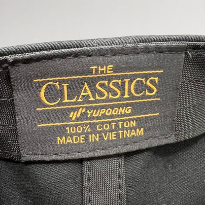 Raree Finds Yupoong The Classics black cotton hat interior label with gold embroidery