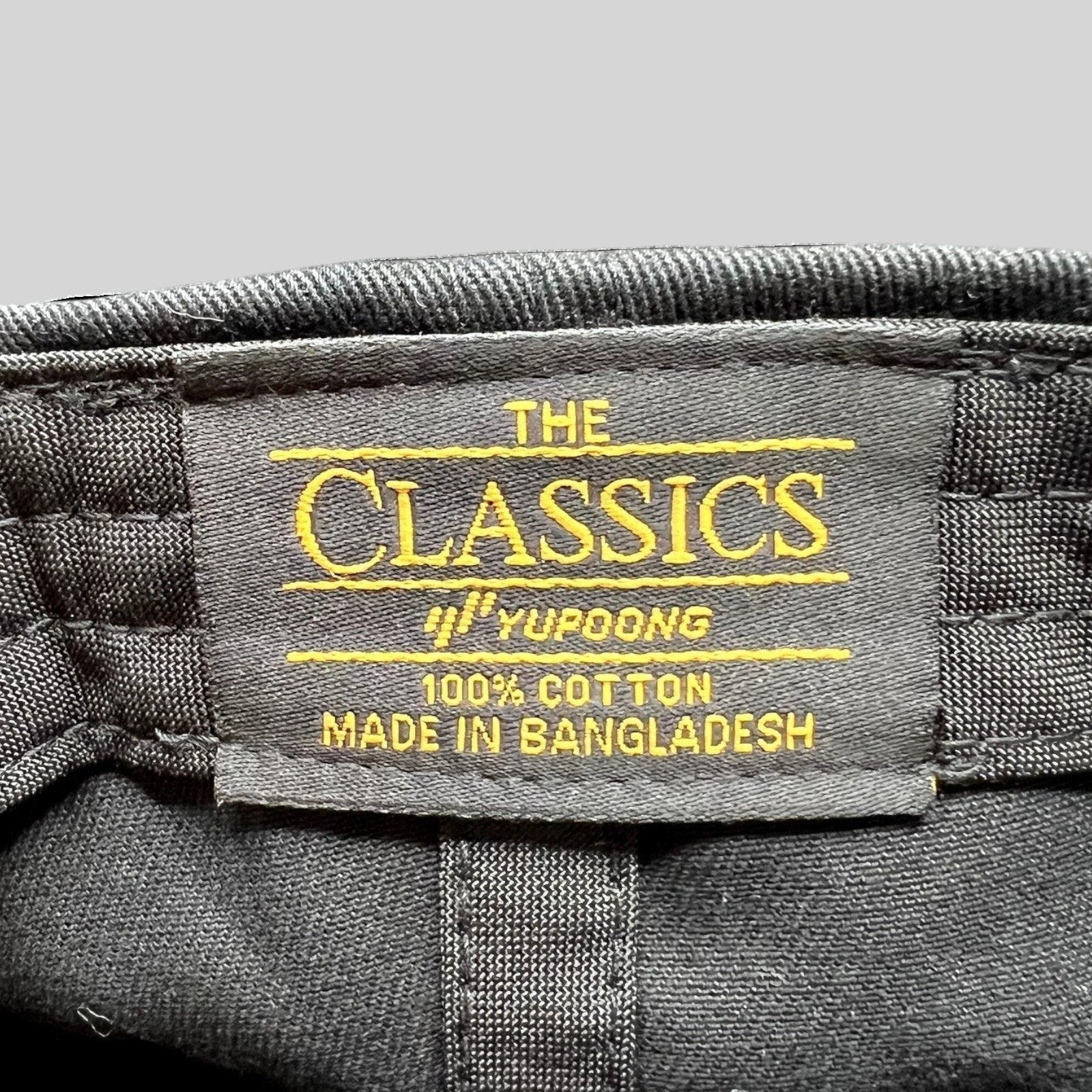 Raree Finds Yupoong The Classics black cotton dad cap interior label showing brand and origin details