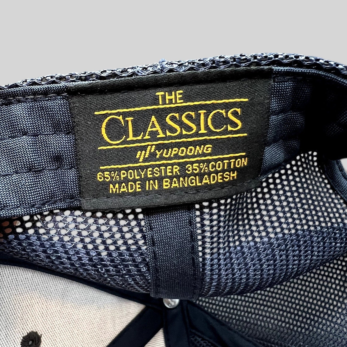 Raree Finds Diller Teen Fellows Yupoong Classics trucker hat interior label showing material and origin details