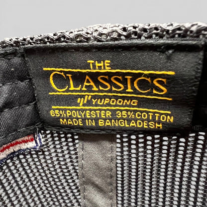 Raree Finds Yupoong Classics interior hat label showing material composition and brand logo on black fabric