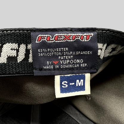 Raree Finds Yupoong Flexfit hat interior label showing size S/M and material composition in gray baseball cap