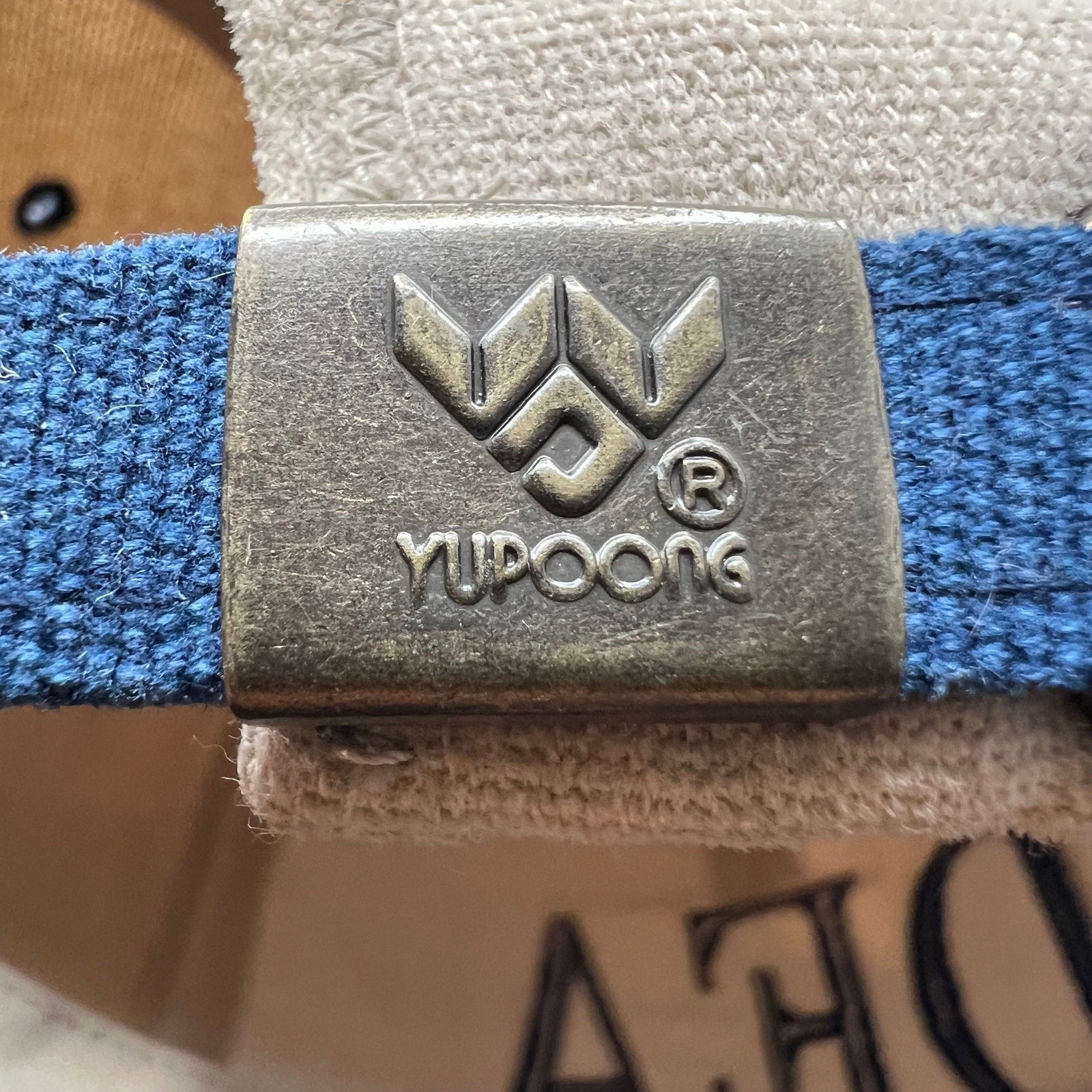 Raree Finds vintage Yupoong strapback hat metal buckle with embossed logo detail