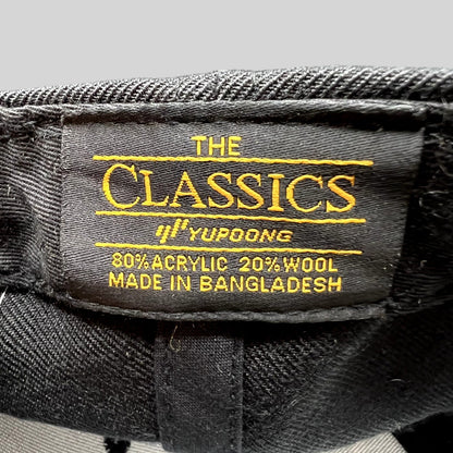 Raree Finds snapback hat interior label showing The Classics Yupoong branding and material composition