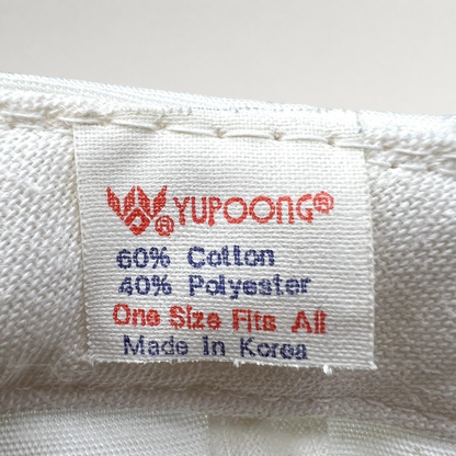 Raree Finds vintage Yupoong hat interior tag showing 60 percent cotton and 40 percent polyester blend made in Korea