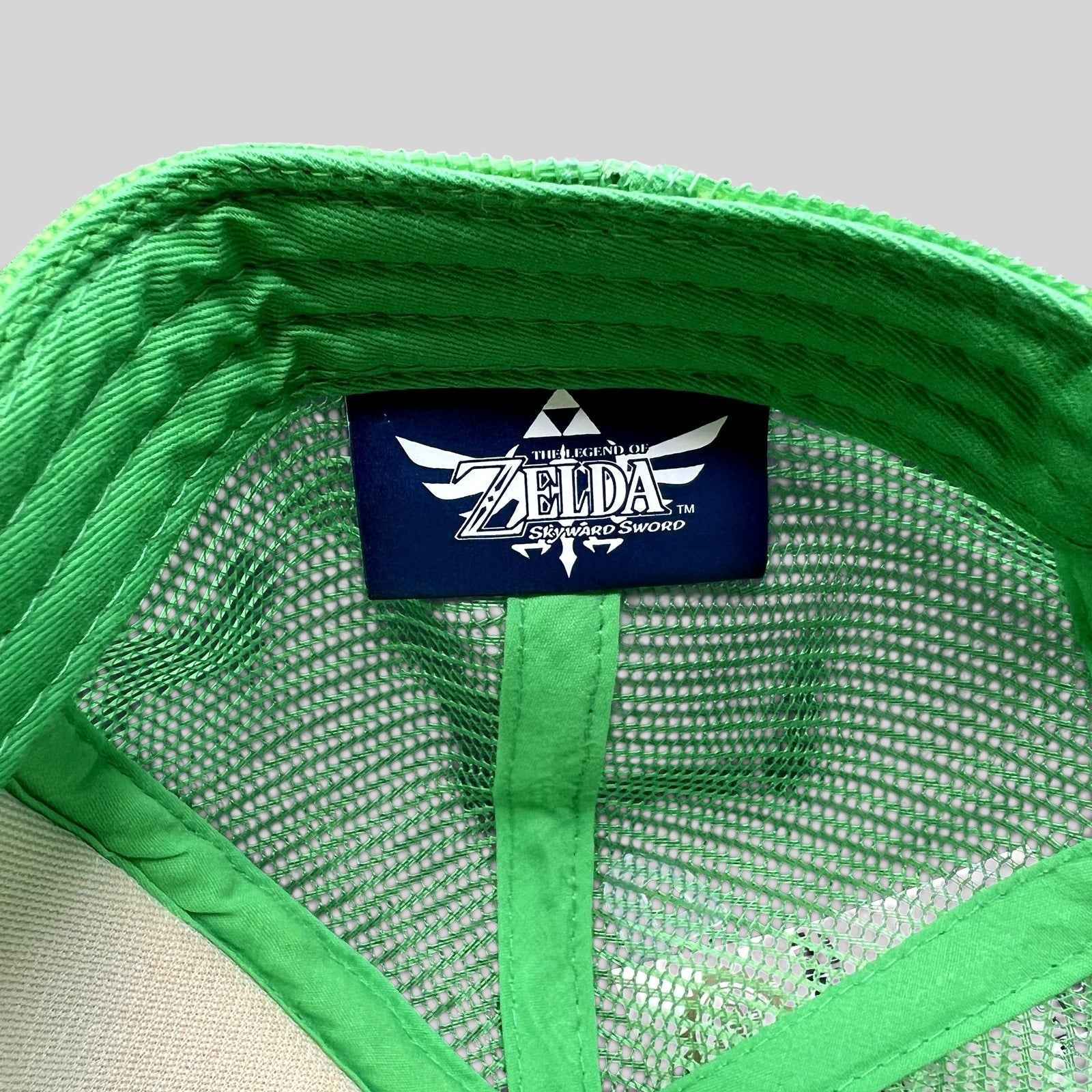 Raree Finds Legend of Zelda Skyward Sword trucker hat interior showing official Nintendo brand tag and green mesh