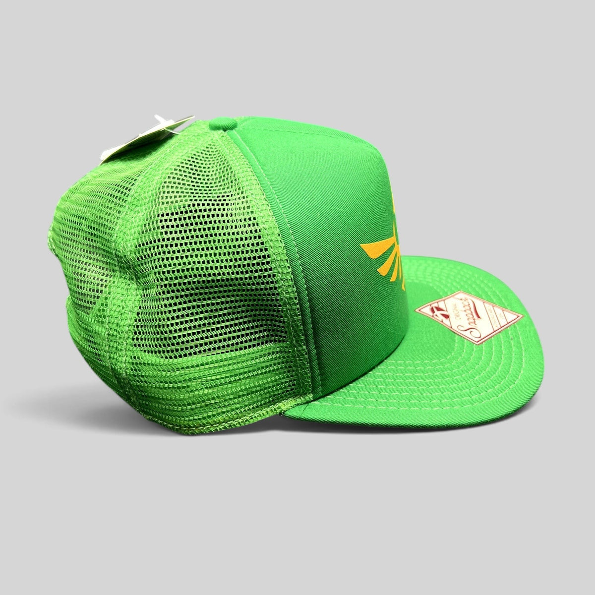 Raree Finds green Legend of Zelda Skyward Sword trucker hat with gold Hylian Crest and mesh back, side view