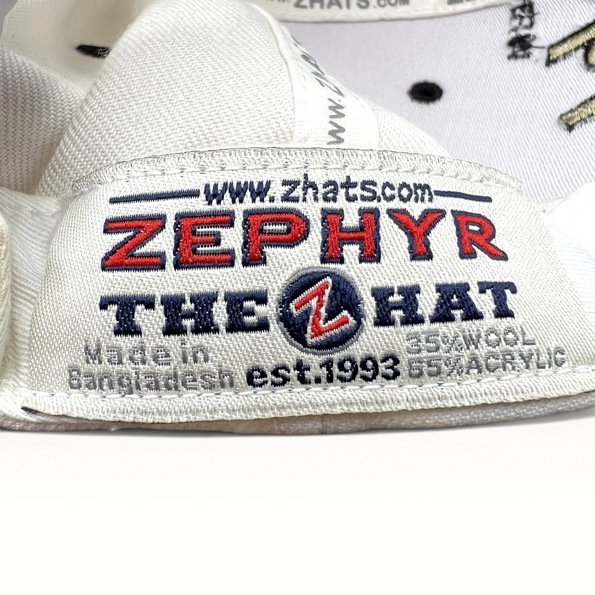 Raree Finds Zephyr hat interior label showing branding, material composition, and origin details