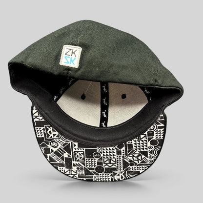 Raree Finds Zhik limited edition fitted cap in black wool with a geometric patterned underbrim and interior branding.