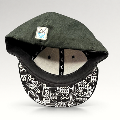 Raree Finds Zhik limited edition fitted cap in black wool with a geometric patterned underbrim and interior branding.