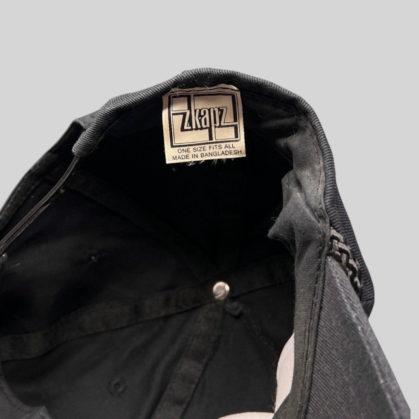 Raree Finds vintage Zkapz snapback interior showing the brand label and black cotton twill construction