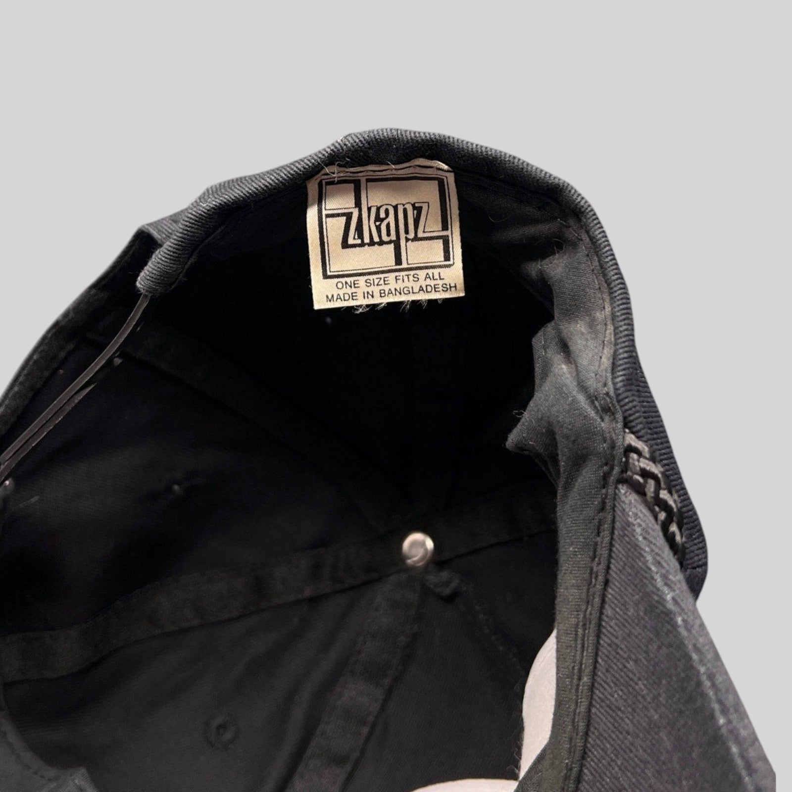 Raree Finds vintage Zkapz snapback interior showing the brand label and black cotton twill construction