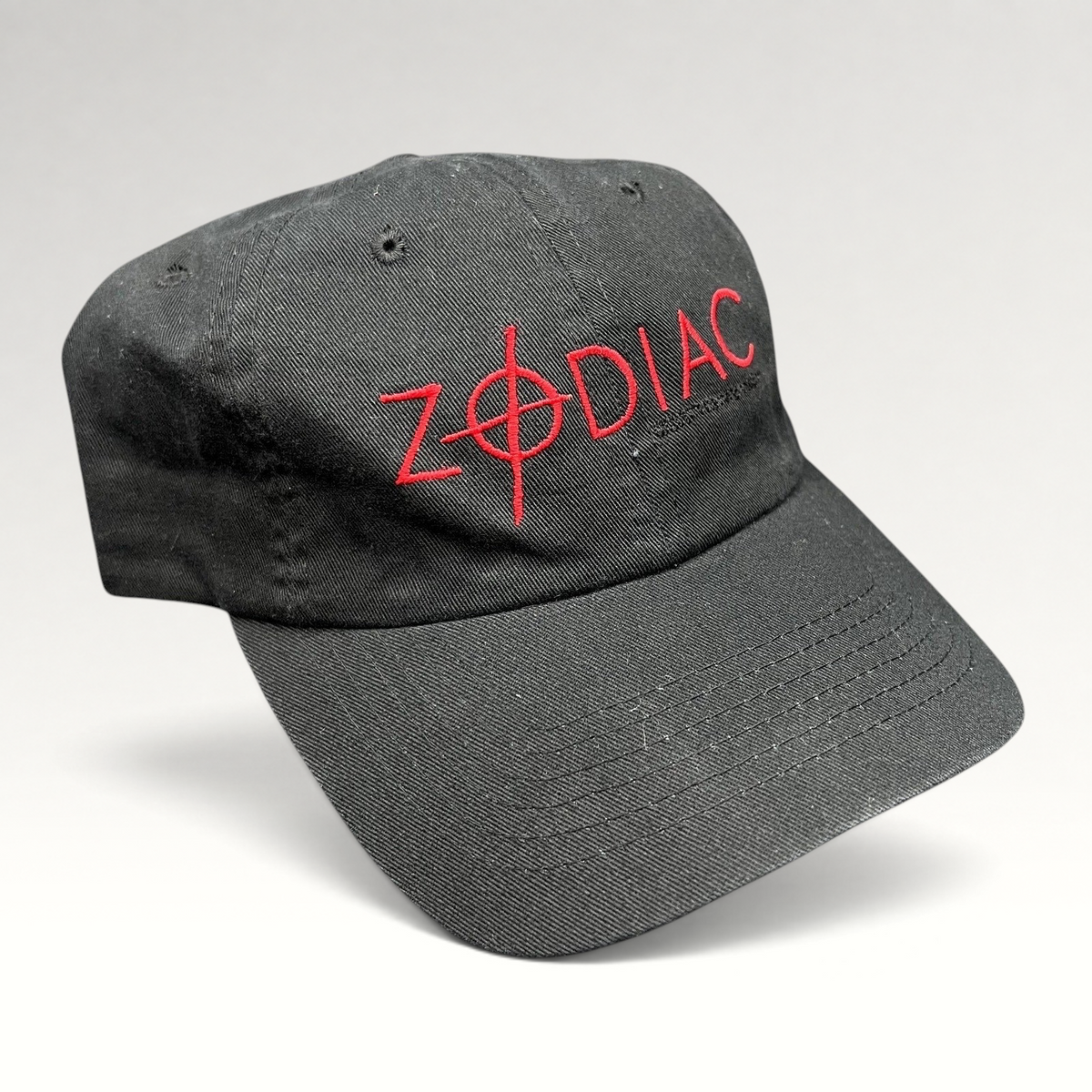 Raree Finds black cotton strapback hat featuring red embroidered ZODIAC movie logo with crosshair detail