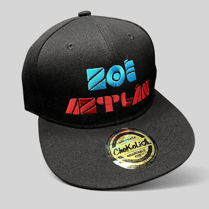 Raree Finds black Chokolids snapback hat featuring embroidered turquoise and red Zoé Aztlán album logo on flat bill