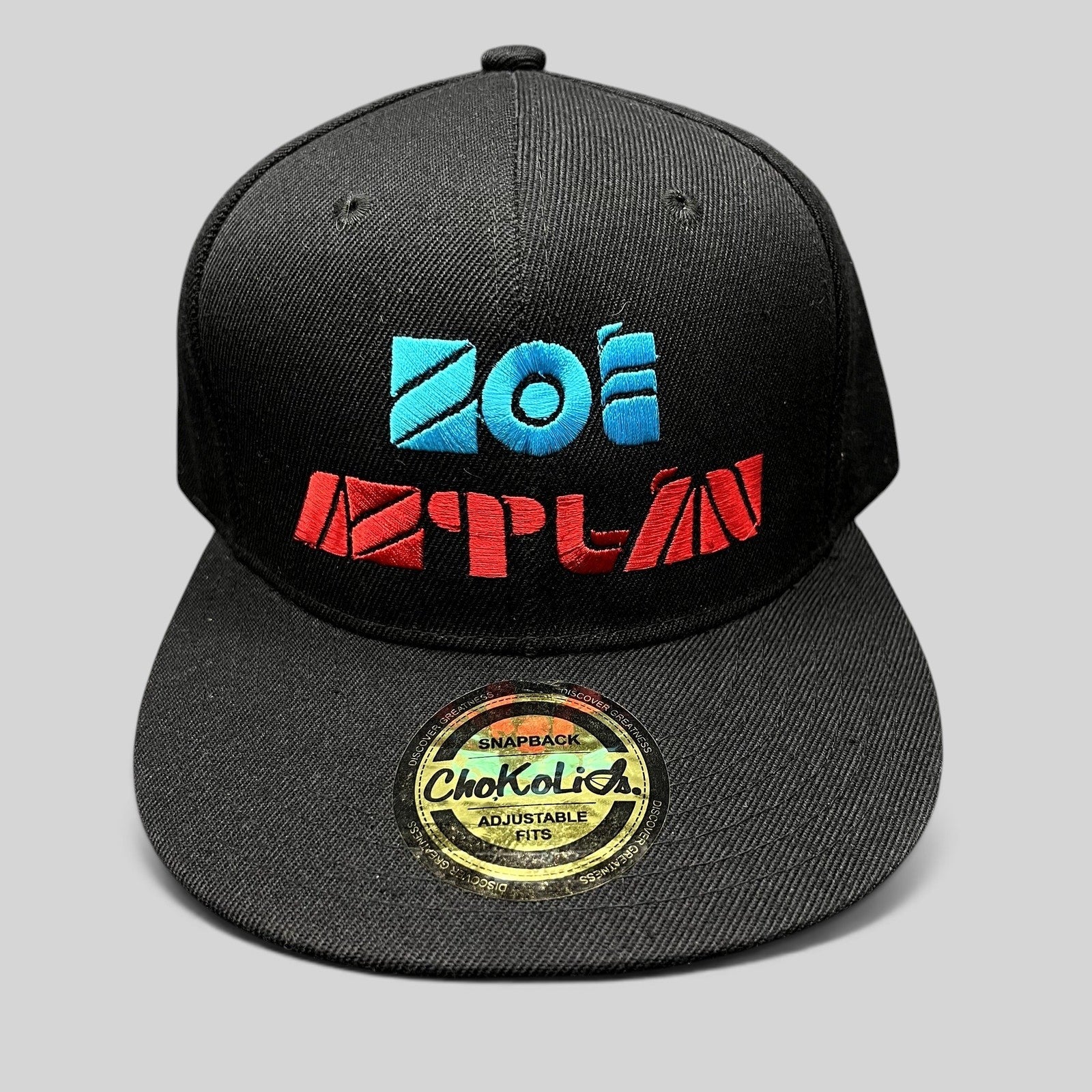 Raree Finds black Chokolids snapback hat featuring embroidered turquoise and red Zoe Aztlan album logo on front