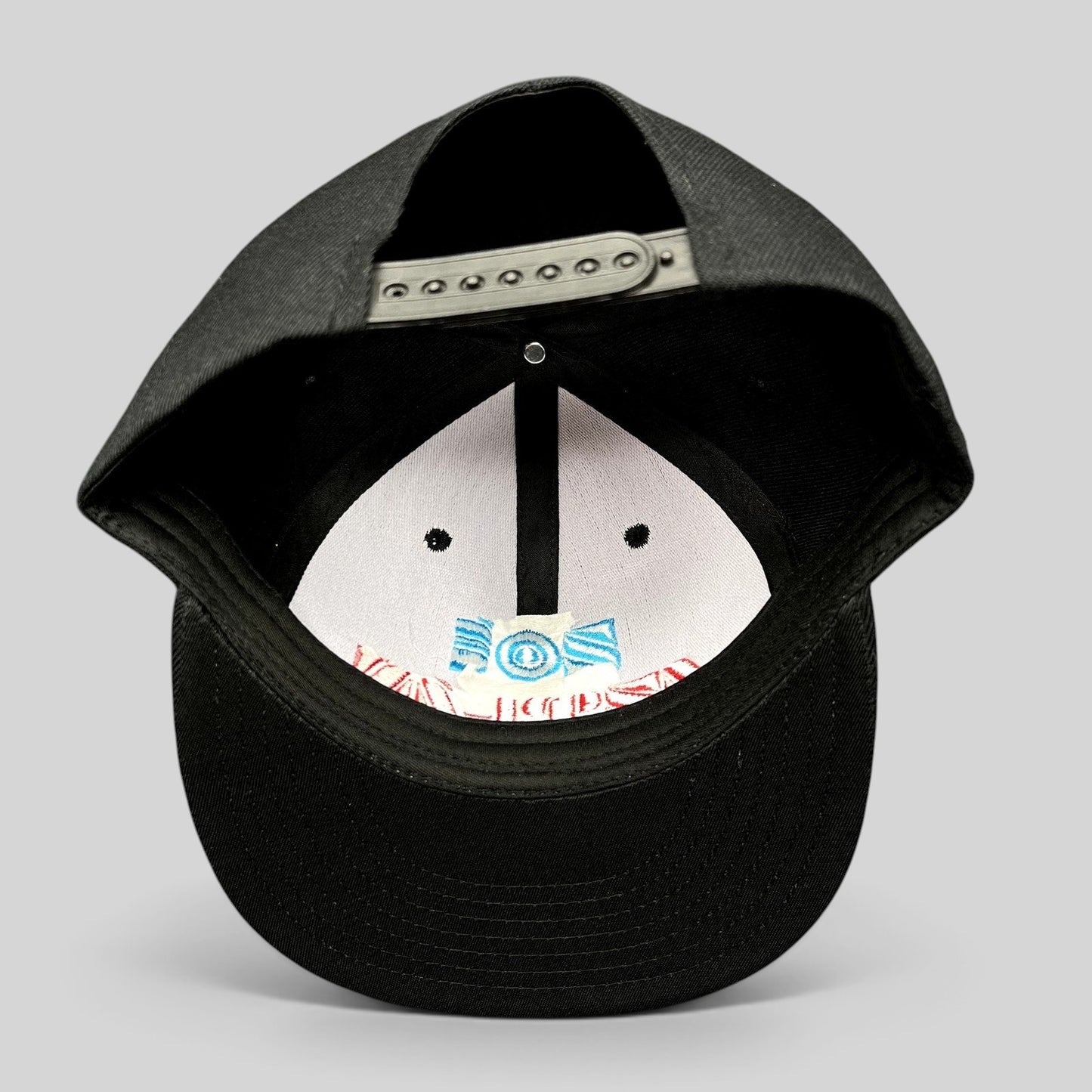 Raree Finds black Chokolids snapback hat featuring interior embroidered Zoé Aztlán album graphics on the front panel