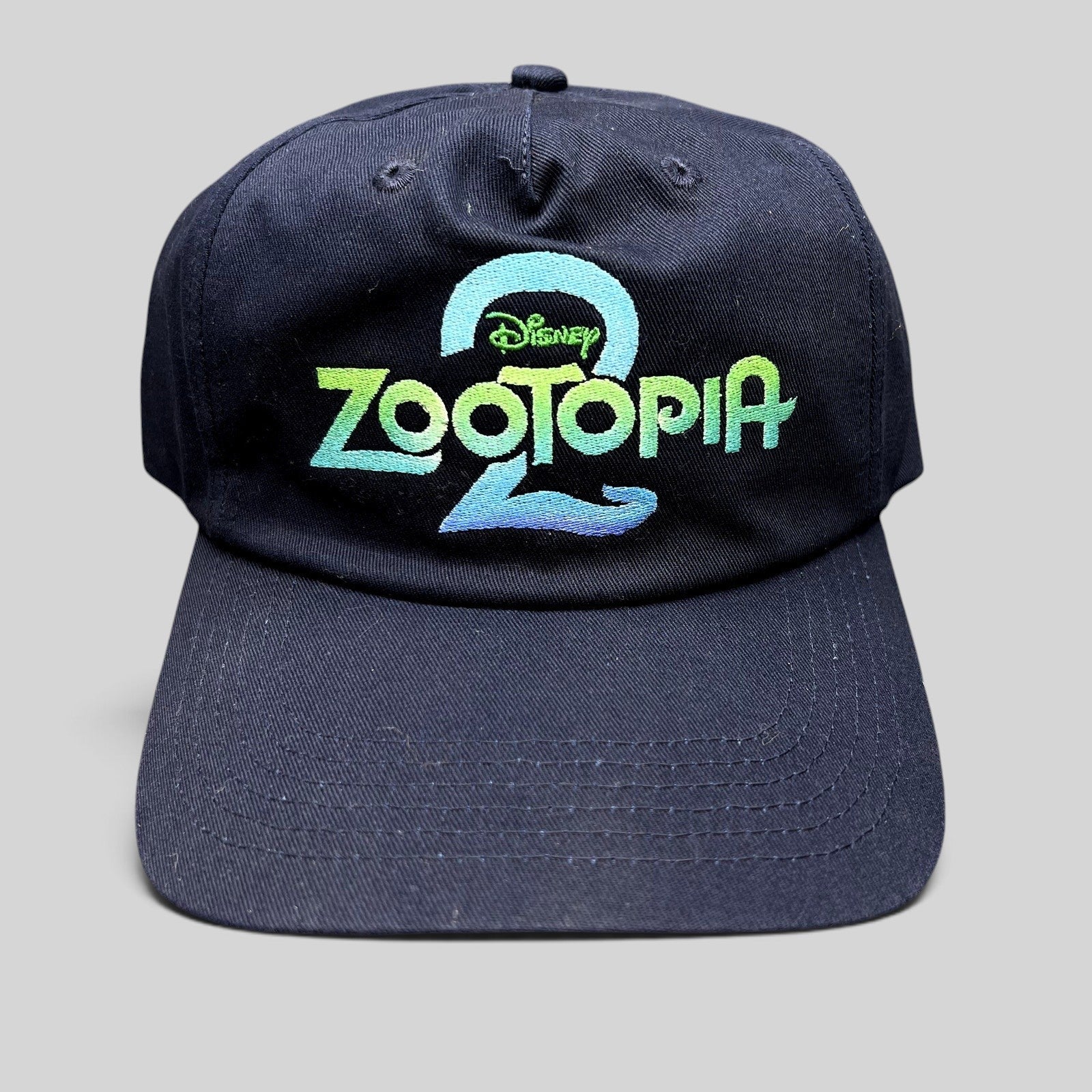 Raree Finds navy blue Disney Zootopia 2 promotional strapback hat with vibrant embroidered logo on the front crown