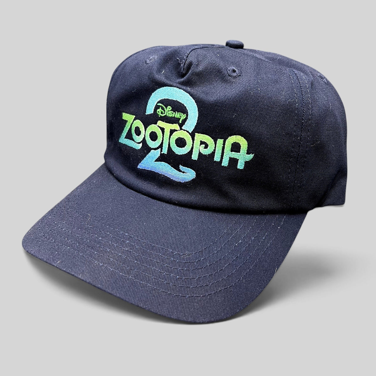 Raree Finds navy blue Zootopia 2 promotional strapback hat with vibrant embroidered logo on the front crown