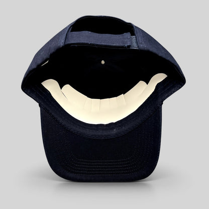 Raree Finds Disney Zootopia 2 promotional navy blue strapback hat, showing the interior adjustable strap and brim.