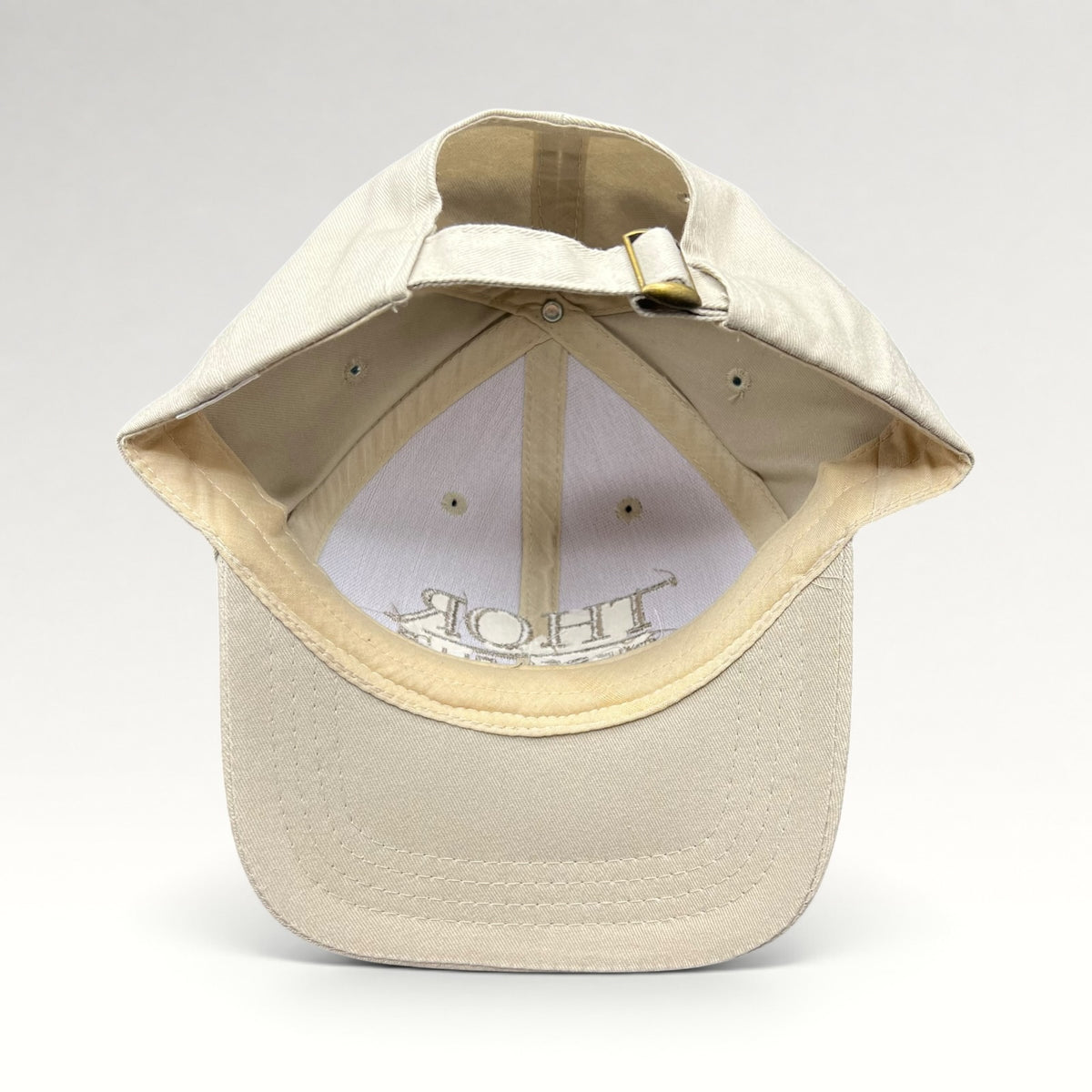 Interior and adjustable strap with metal clasp